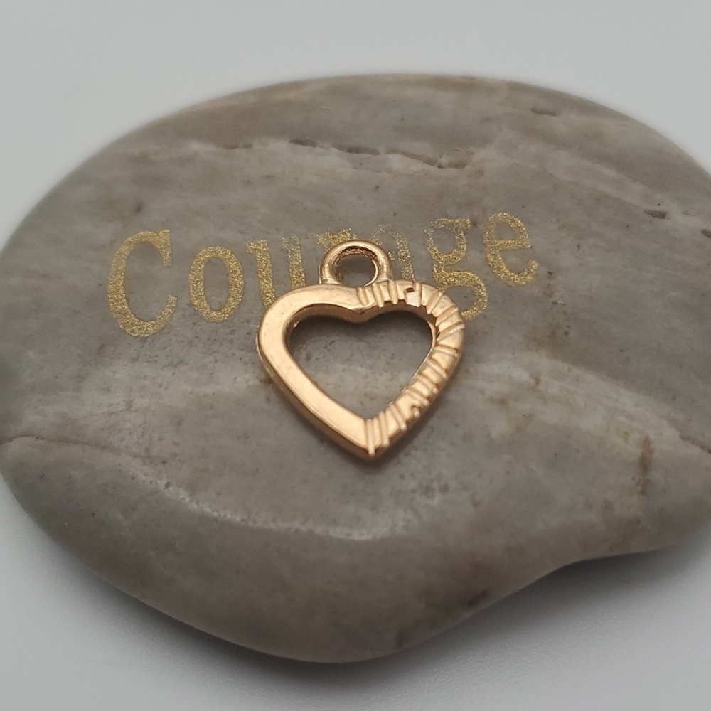 Starburst heart charm‎